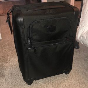 Tumi carry on suitcase